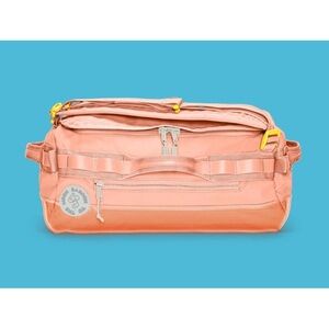 Baboon to the Moon go bag mini in sunset coral 32L